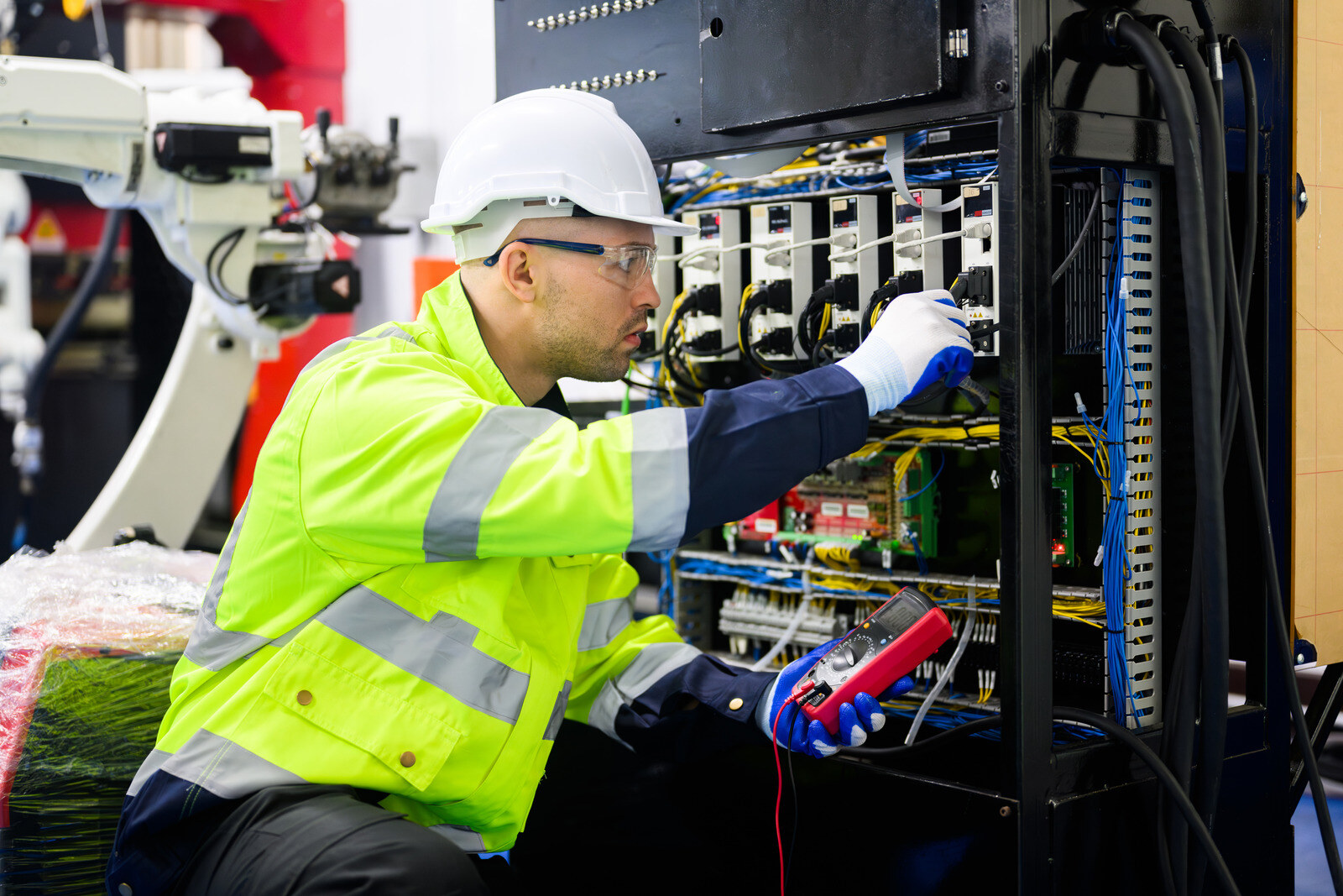 canva-portrait-of-electrician-working-with-terminal-power-cable-equipment-MAFlO5V38C4